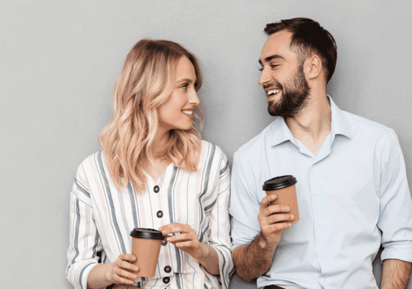 young-couple-planning-coffee-in-hand