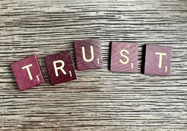Letter blocks that spell the word Trust